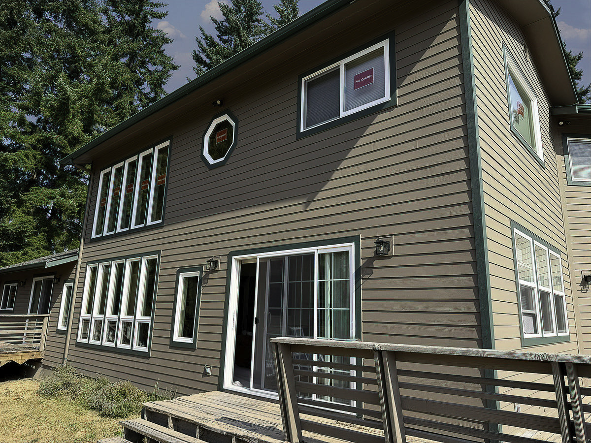 Full exterior renovation with updated siding and trim details