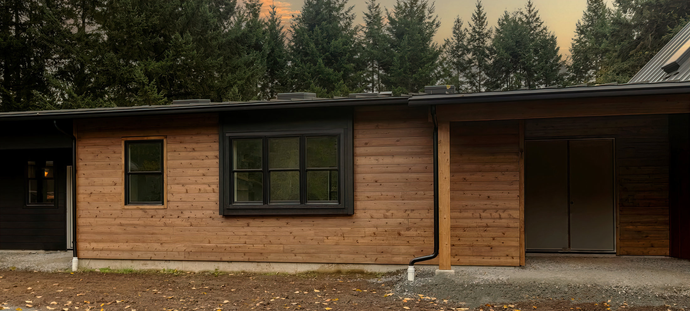 Residential siding with covered entry and wood accent detail by Breeze Siding
